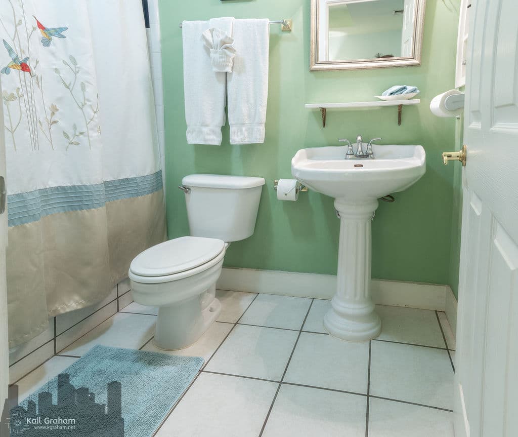 Private bathroom with tub and shower combo