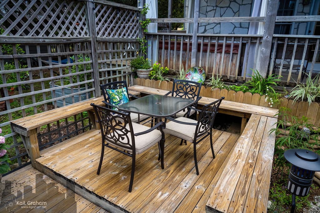 Deck below the private hot tub with privacy curtains